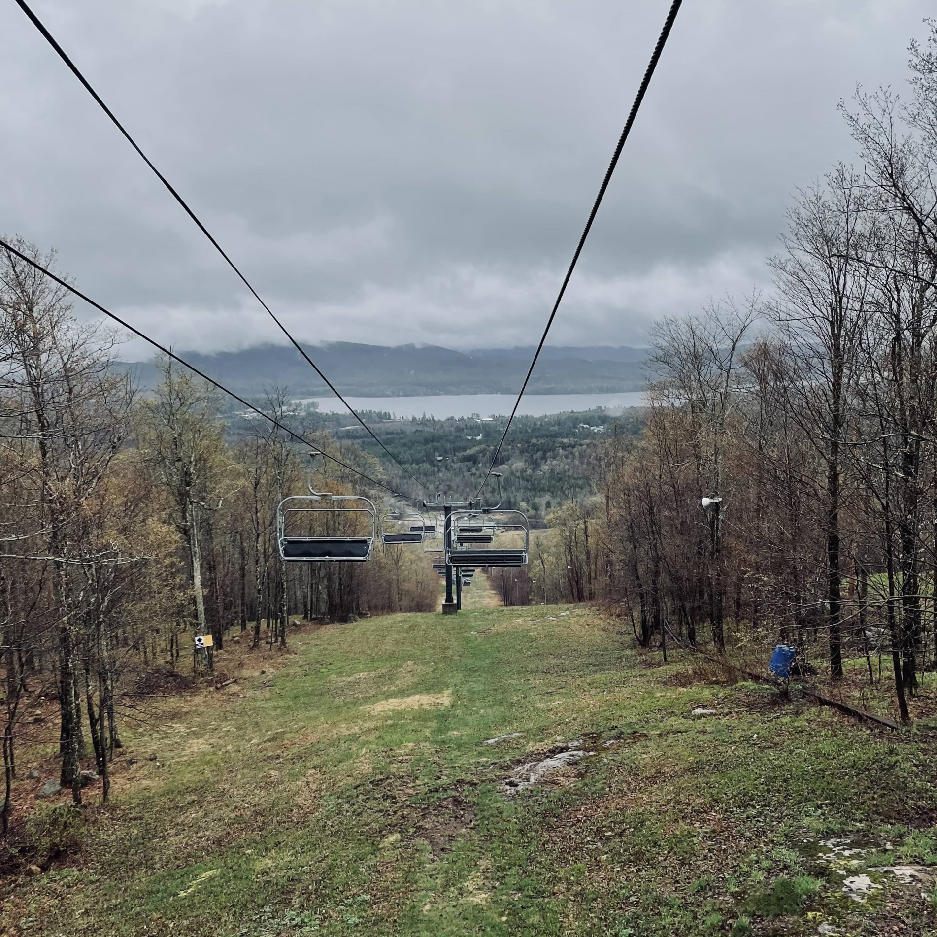 going down ski lift in early spring